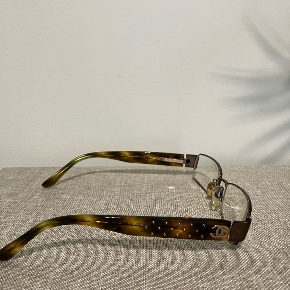 CHANEL Elegant Black and Gold Glasses